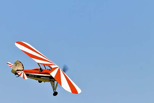 leisure activities white and red monoplane airplane